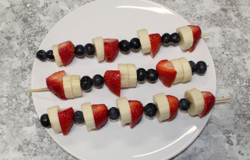 Blueberries, bananas, and strawberries on a skewer to make Fourth of July Kabobs