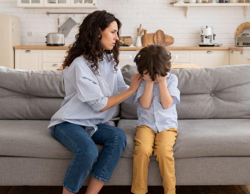 Mother comforting child after a sad event
