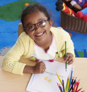 http://preschool%20girl%20drawing%20with%20colored%20pencils%20at%20daycare