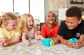 School-age children having fun together while learning through a group activity