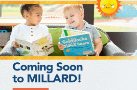 Two young children read books together